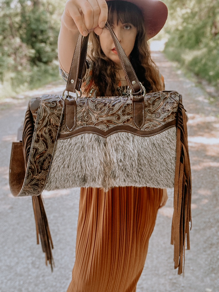 Our little runaway bag in a stunning brown hide/ leather combination